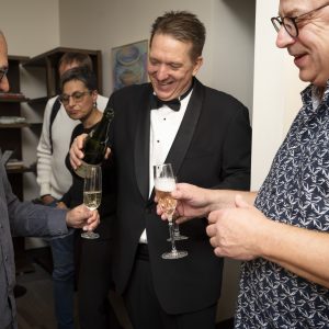 Jeff pours the bubbly